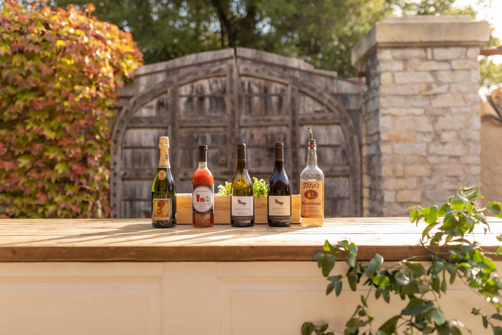 brunch bar with bloody mary mix and wine bottles from sojourn